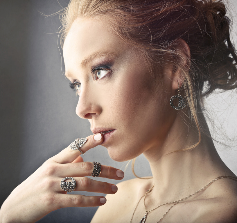 Woman Wearing Rings and Earrings